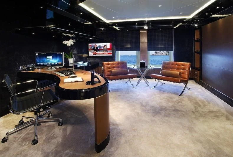 a room with a table and chairs aboard TALISMAN C Yacht for Charter