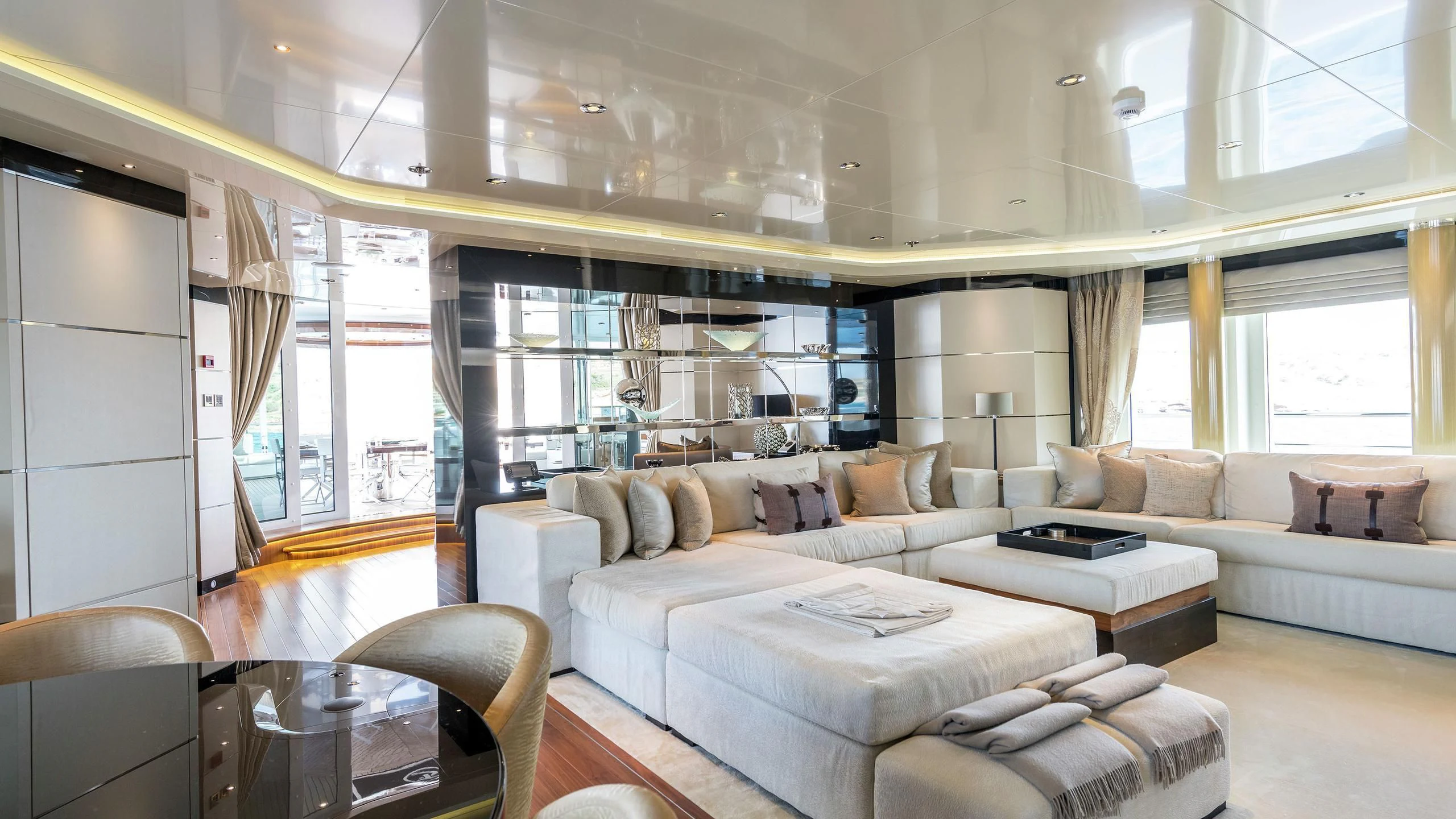 a living room with a couch and a table aboard TALISMAN C Yacht for Charter
