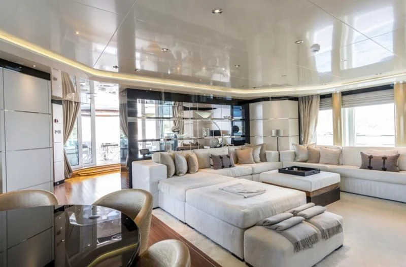 a living room with a couch and a table aboard TALISMAN C Yacht for Charter