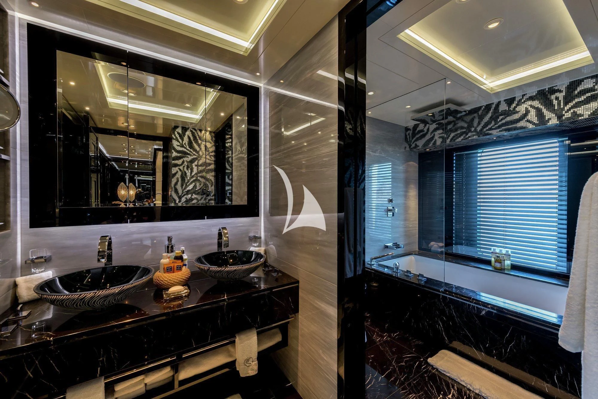 a bathroom with sinks and mirrors aboard TALISMAN C Yacht for Charter