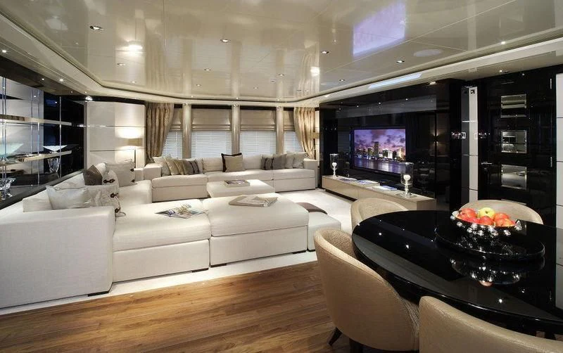 a living room with a large screen aboard TALISMAN C Yacht for Charter