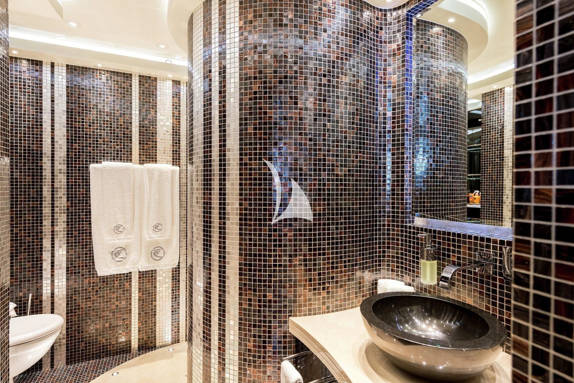 a bathroom with a sink and a shower aboard TALISMAN C Yacht for Charter
