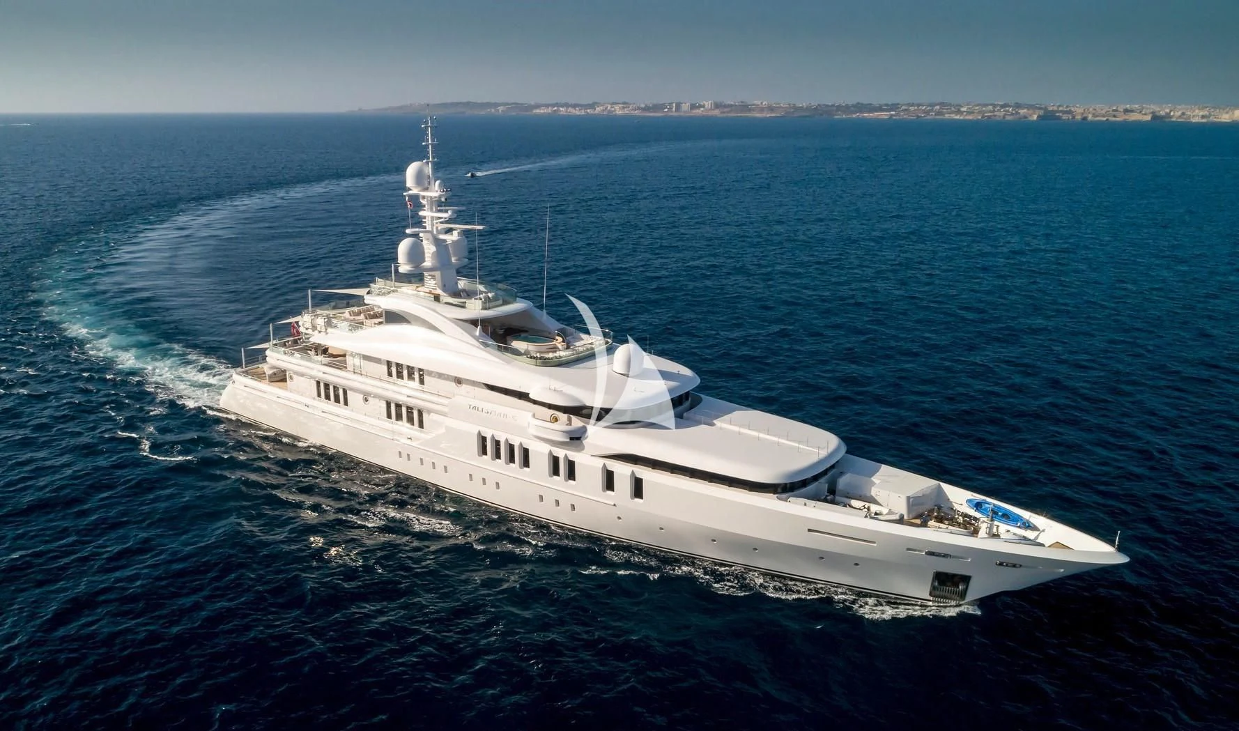 a large white boat in the water aboard TALISMAN C Yacht for Charter