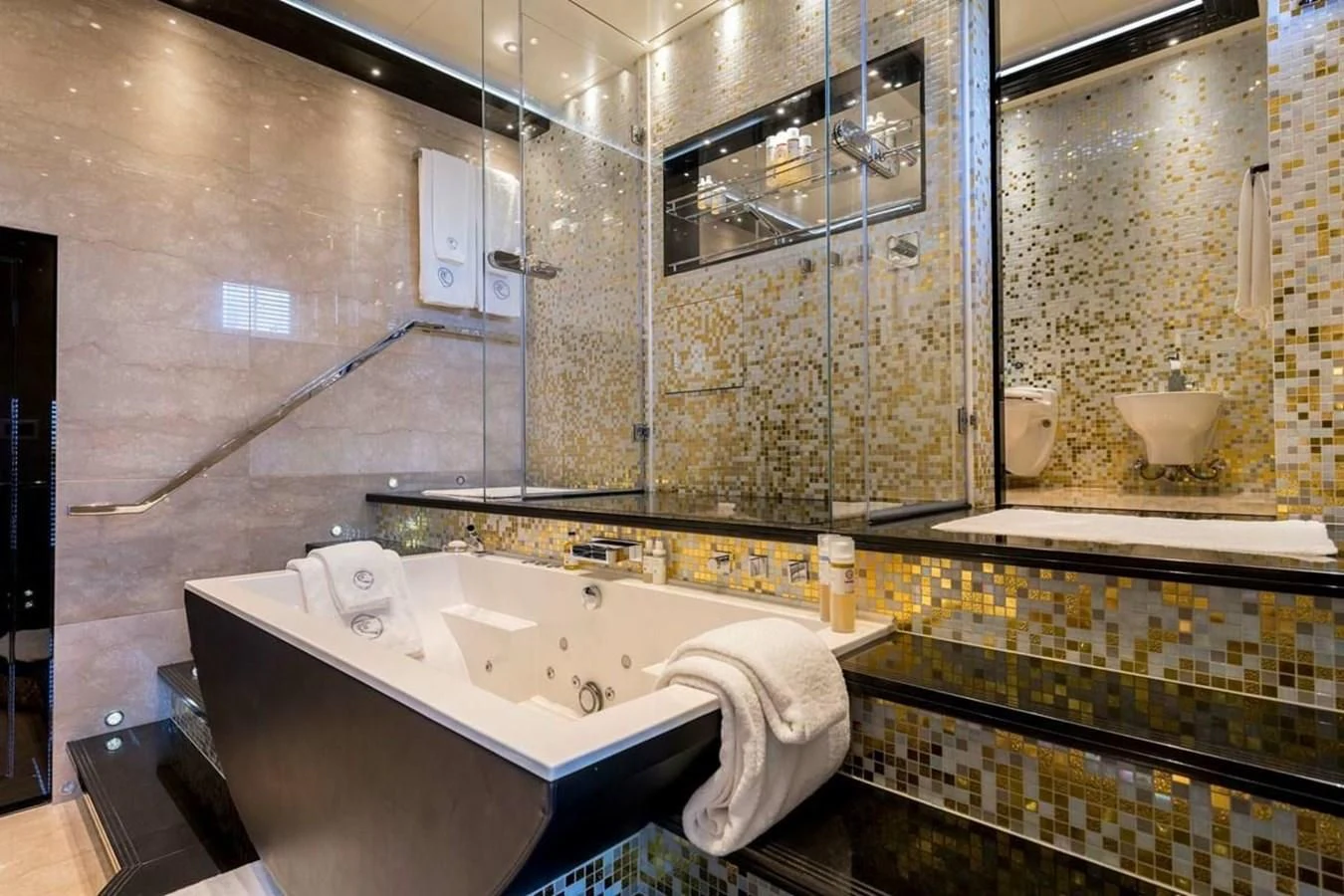 a bathroom with a large mirror aboard TALISMAN C Yacht for Charter