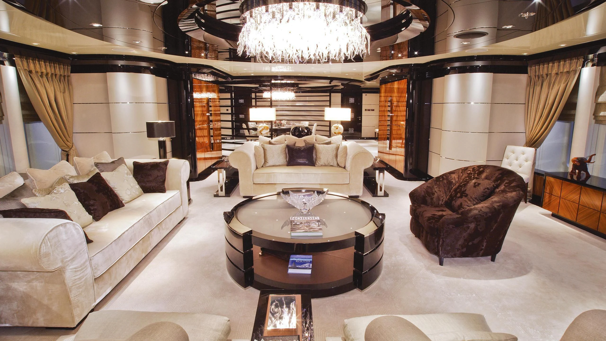 a living room with a large chandelier aboard TALISMAN C Yacht for Charter