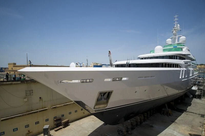 a large ship in a harbor aboard TALISMAN C Yacht for Charter