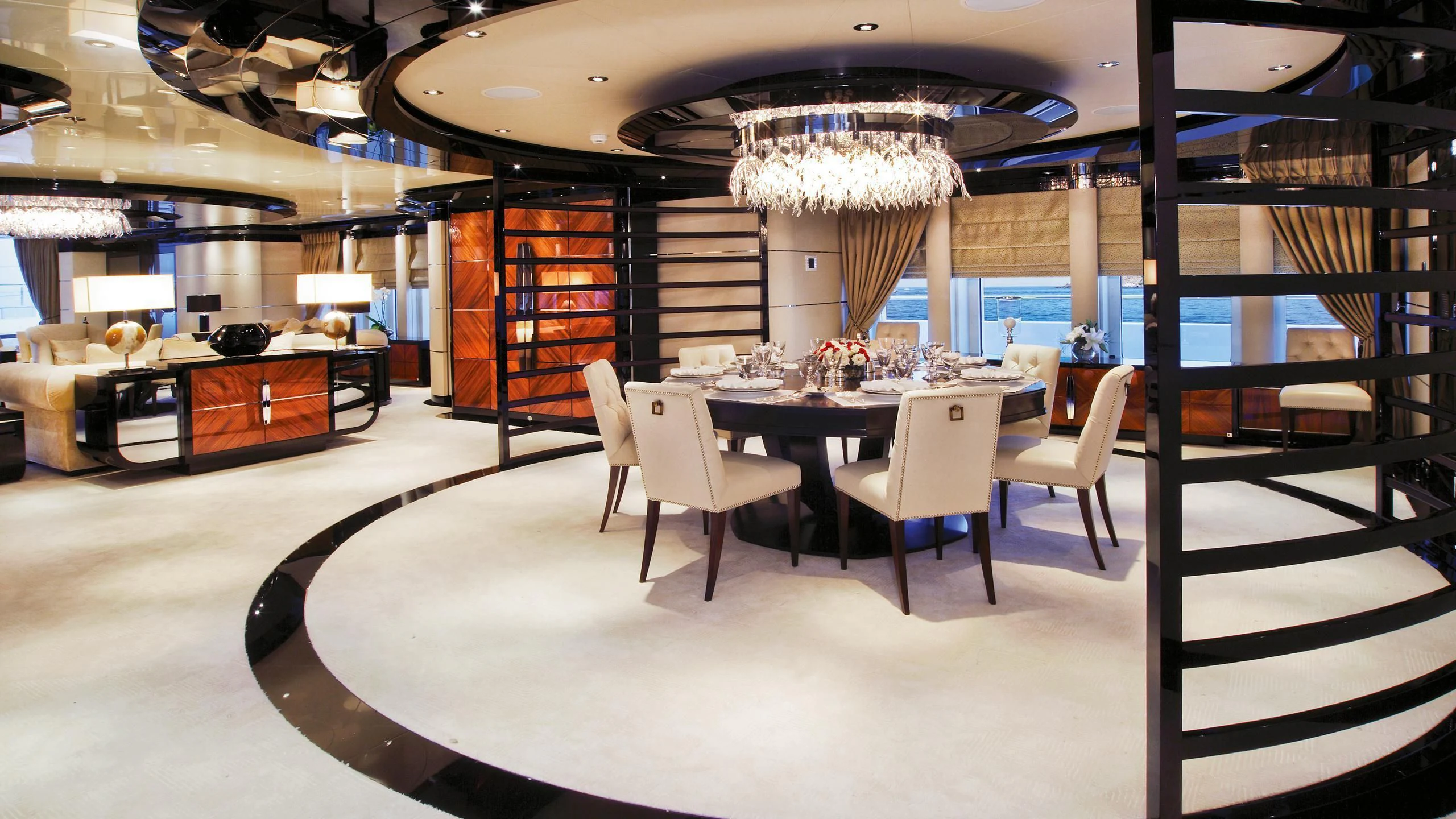 a room with a table chairs and a large mirror aboard TALISMAN C Yacht for Charter