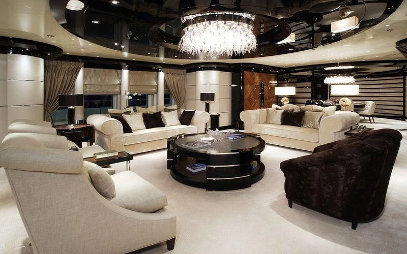 a living room with a large chandelier aboard TALISMAN C Yacht for Charter