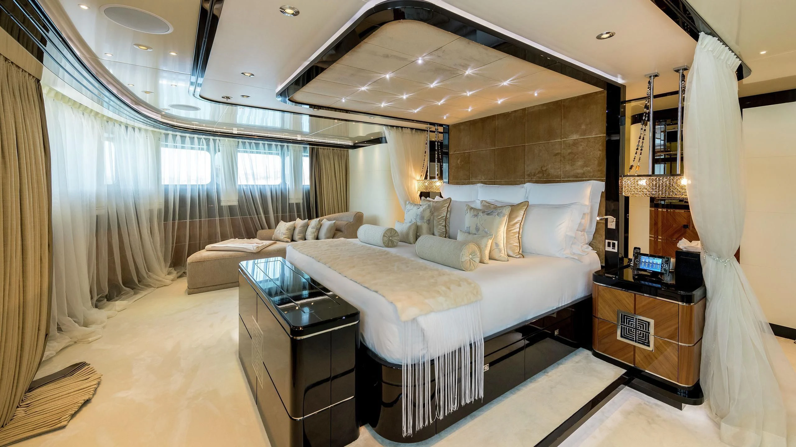 a room with a bed and a desk aboard TALISMAN C Yacht for Charter