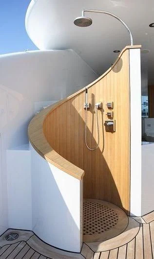 a wooden cabinet with a light fixture aboard TALISMAN C Yacht for Charter