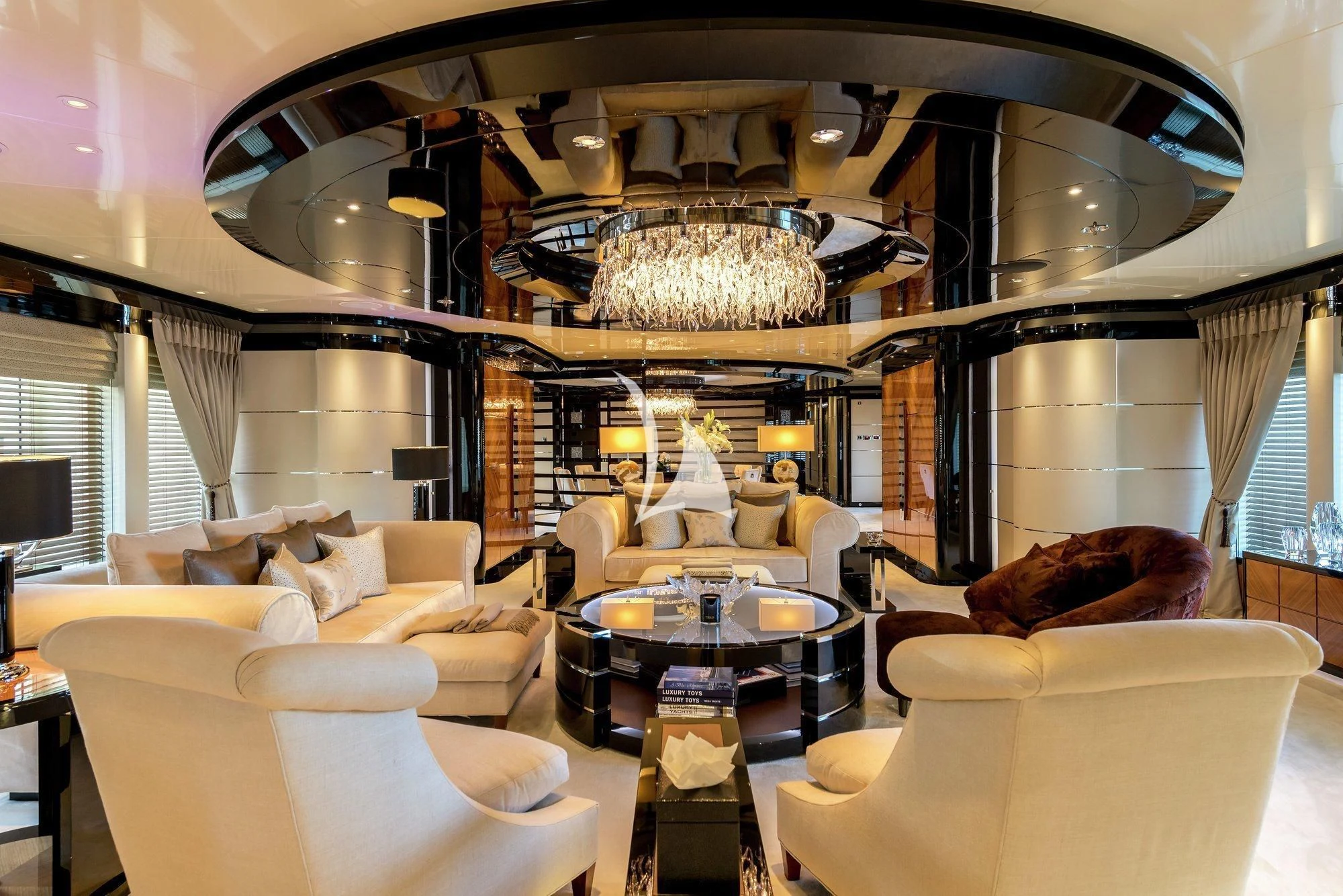 a large living room with a chandelier aboard TALISMAN C Yacht for Charter