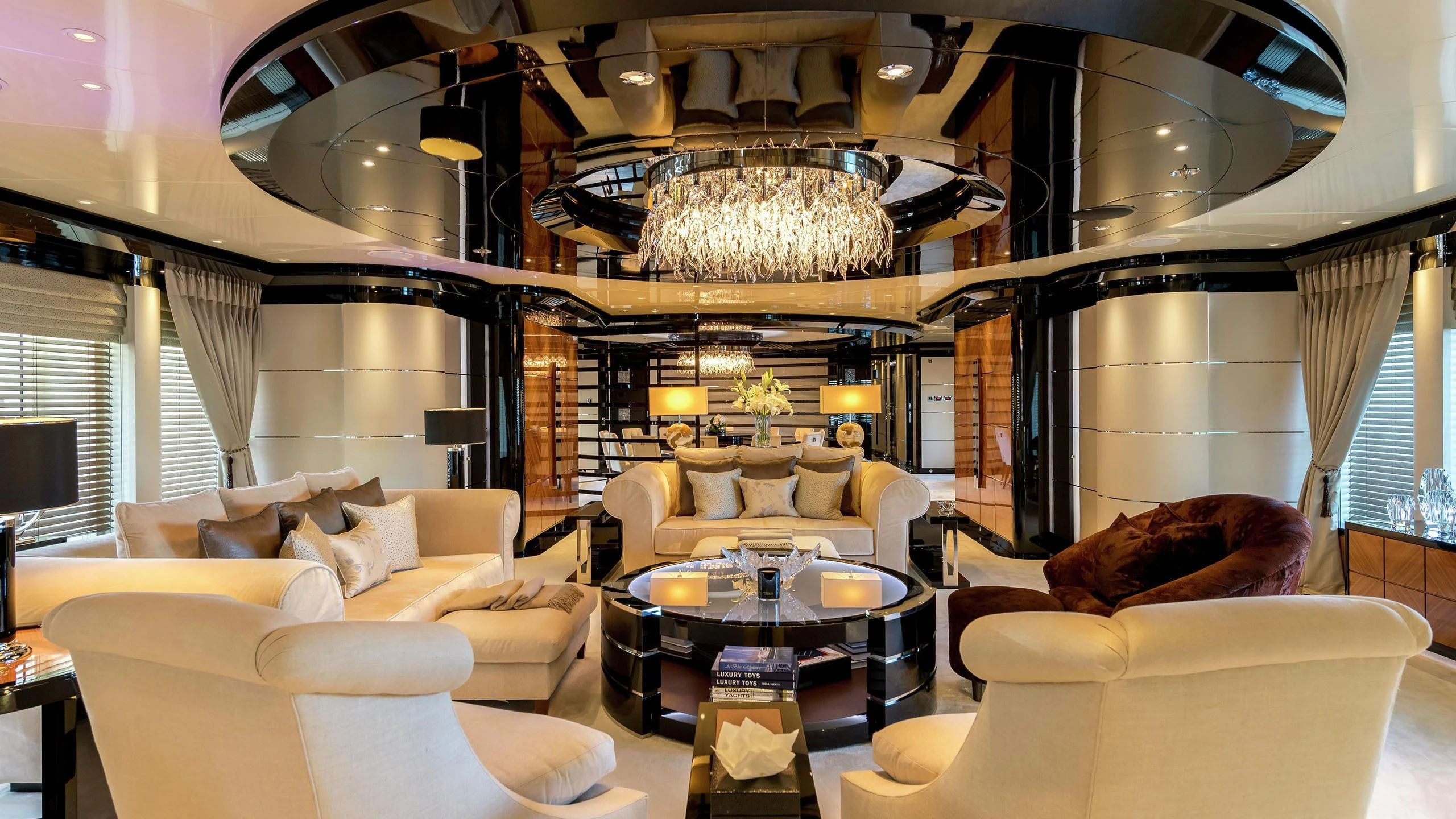 a large room with a chandelier and a couch aboard TALISMAN C Yacht for Charter