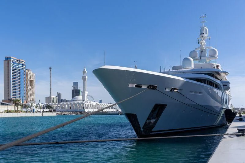 a large white boat on a dock aboard TALISMAN C Yacht for Charter