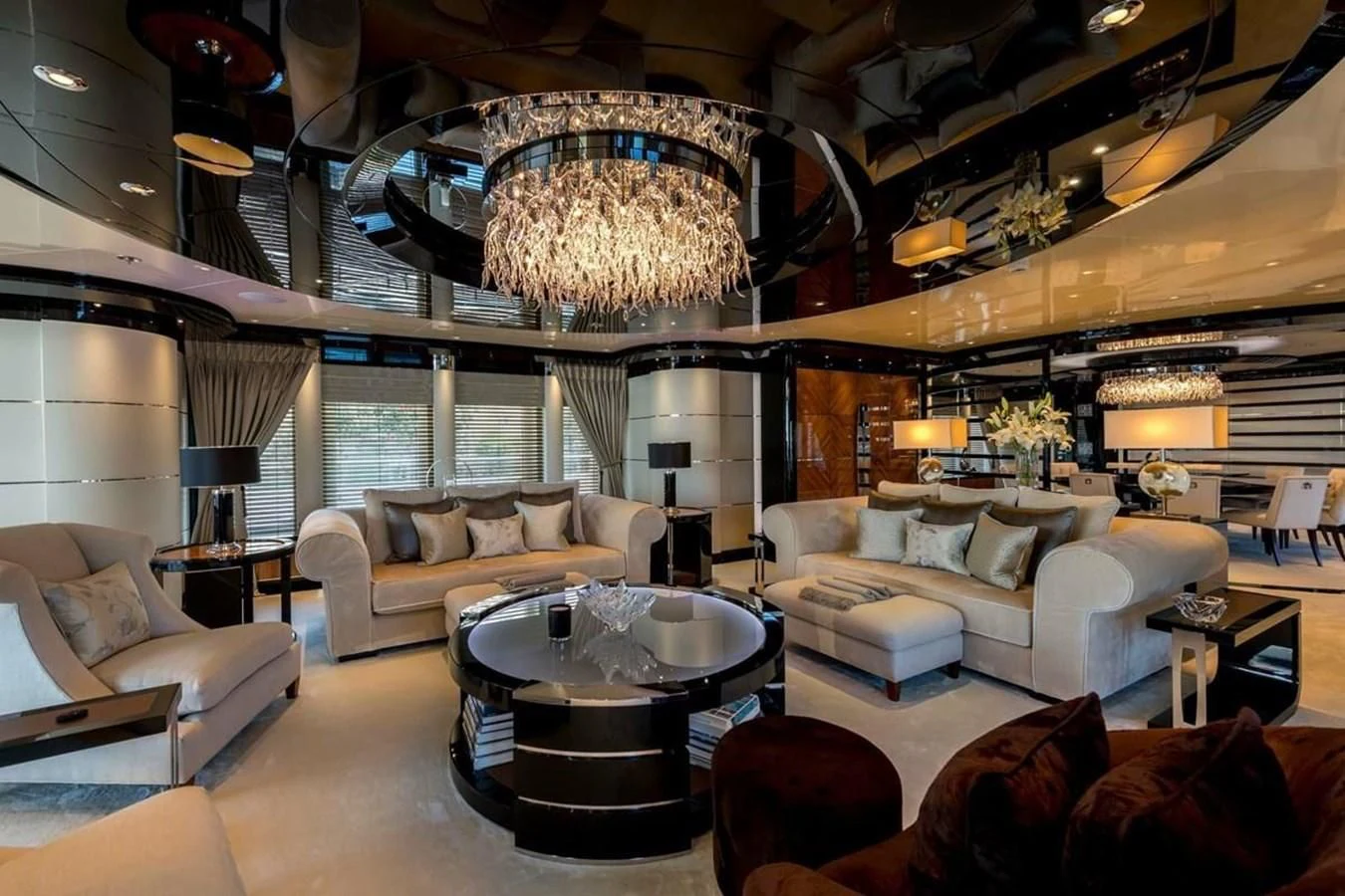 a living room with a chandelier aboard TALISMAN C Yacht for Charter
