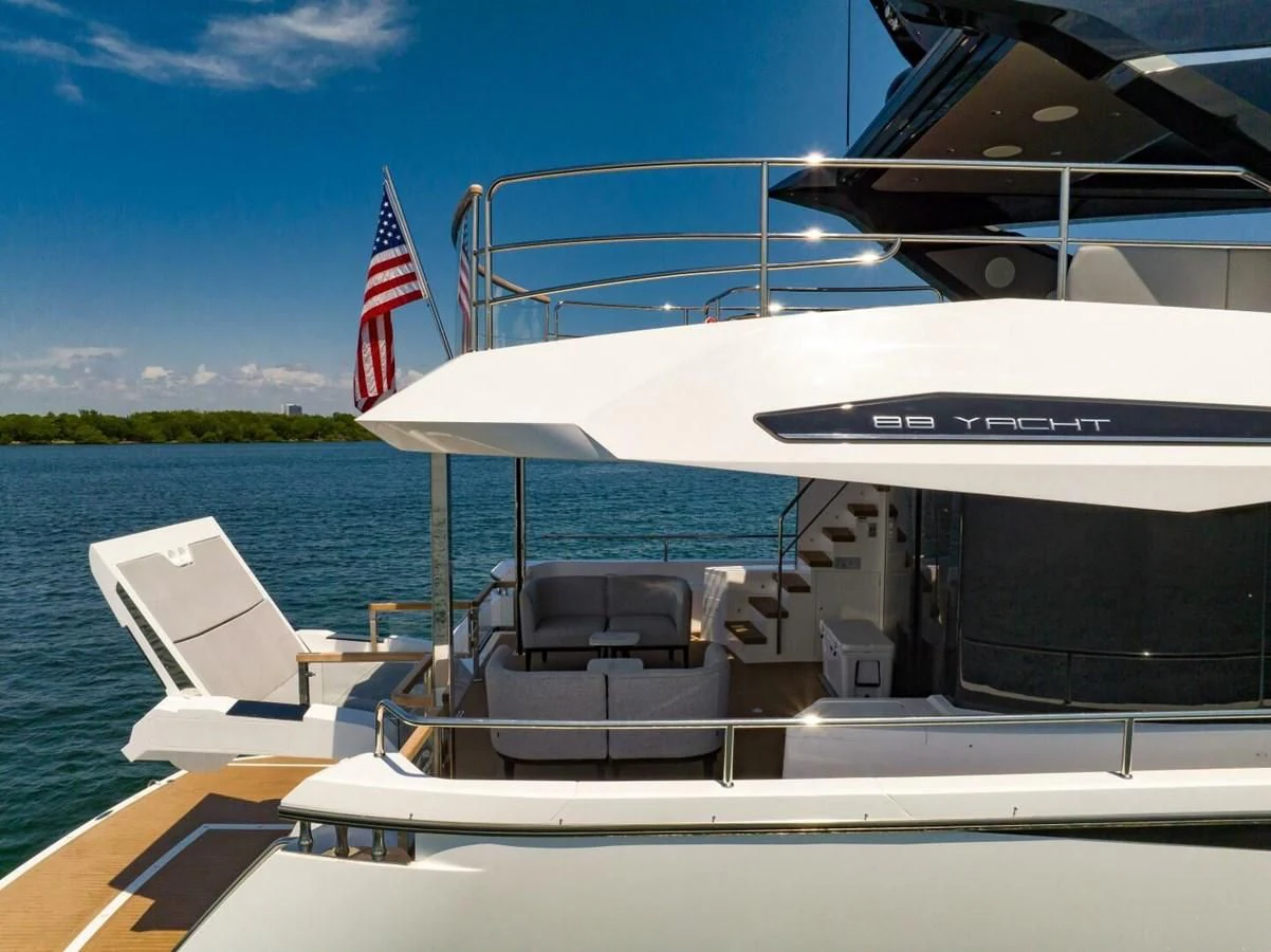 a boat with a flag on the front aboard 76 YACHT Yacht for Sale