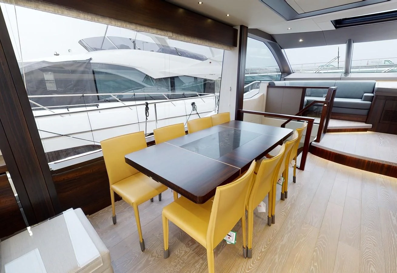 a room with a table and chairs aboard 76 YACHT Yacht for Sale