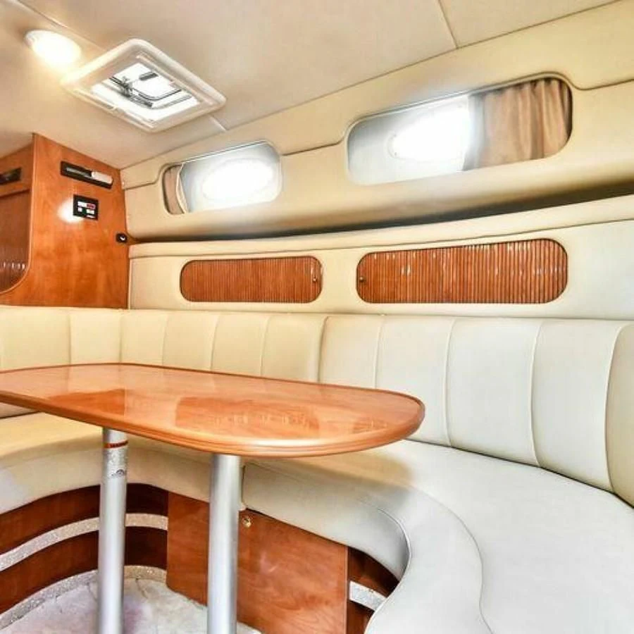 a room with a table and chairs aboard 76 YACHT Yacht for Sale