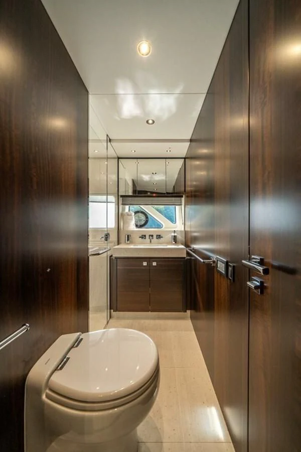 a bathroom with a toilet and a shower aboard 76 YACHT Yacht for Sale
