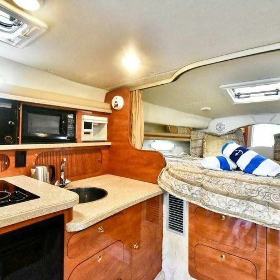 a bathroom with a bed and a sink aboard 76 YACHT Yacht for Sale