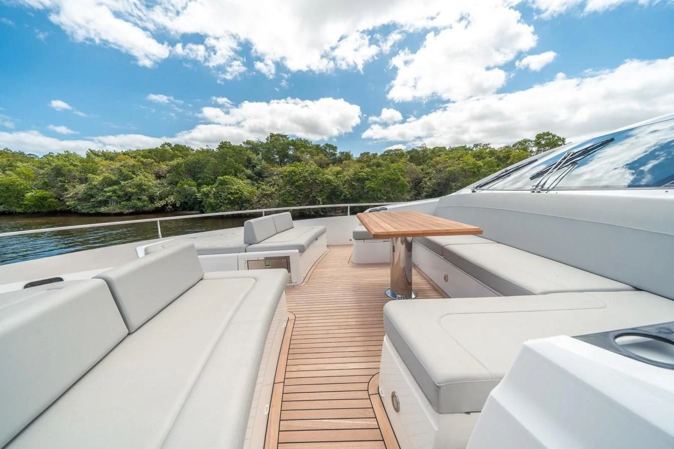 a deck with a table and chairs on it aboard 76 YACHT Yacht for Sale