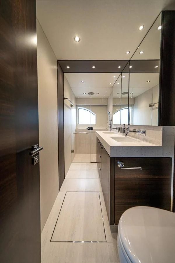 a bathroom with a sink and a mirror aboard 76 YACHT Yacht for Sale