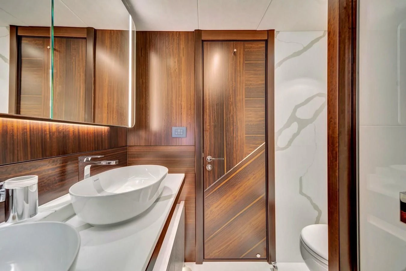 a bathroom with a sink and a mirror aboard 76 YACHT Yacht for Sale