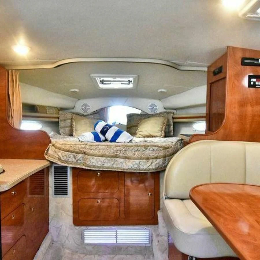 a room with a bed and a chair aboard 76 YACHT Yacht for Sale