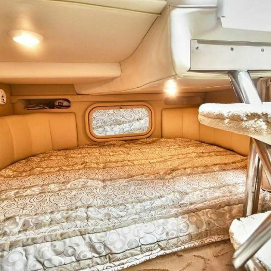 a bed with a white comforter aboard 76 YACHT Yacht for Sale