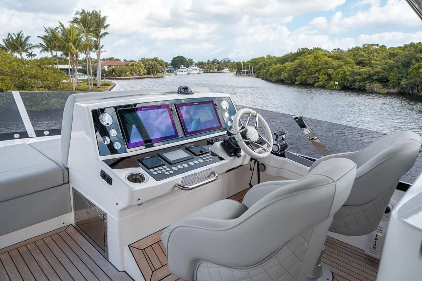 a white car with a steering wheel on a boat aboard 76 YACHT Yacht for Sale