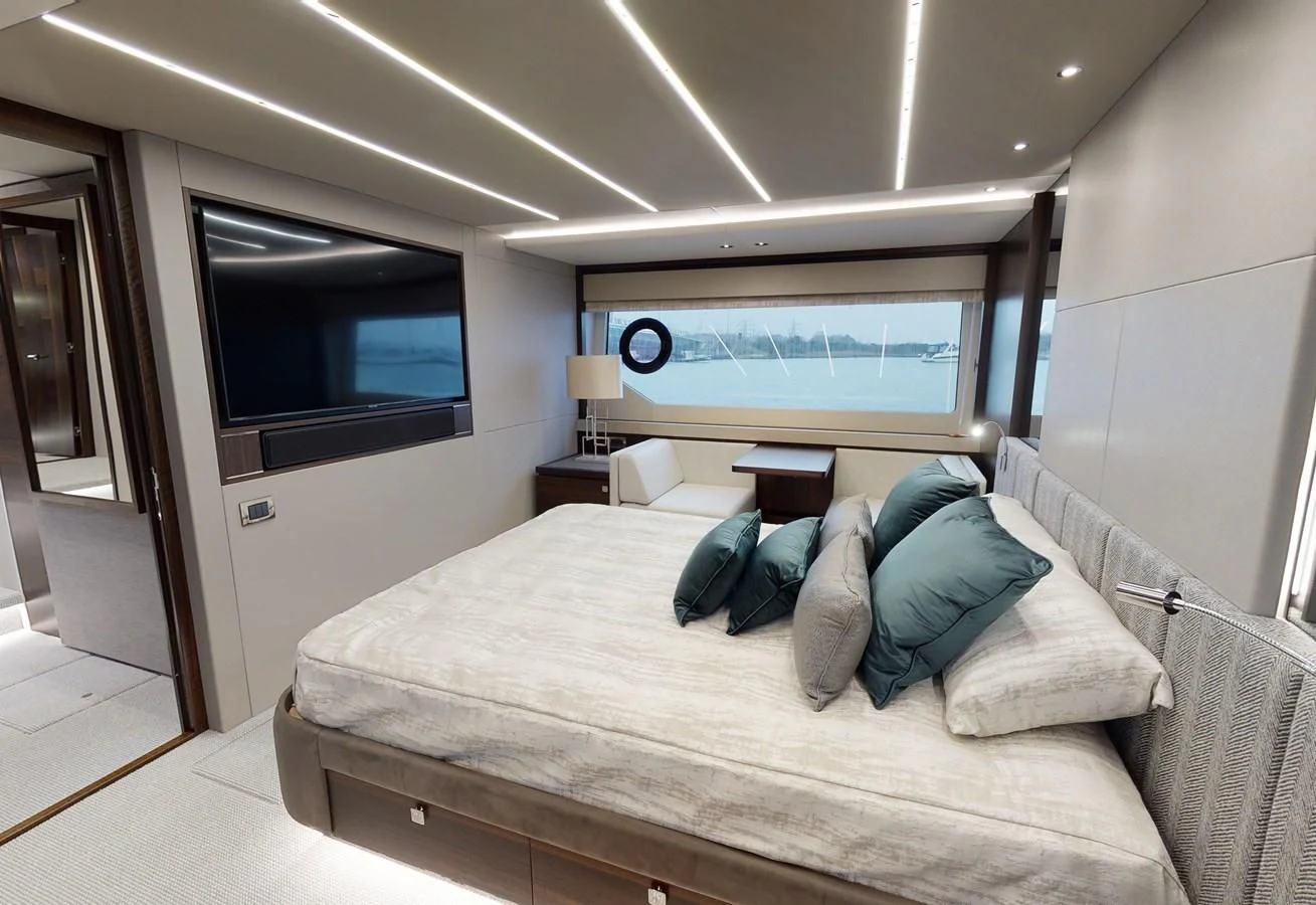 a bed with a television on the wall aboard 76 YACHT Yacht for Sale
