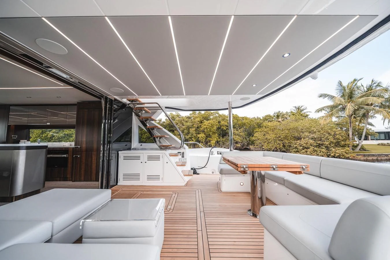 a room with a deck and chairs aboard 76 YACHT Yacht for Sale
