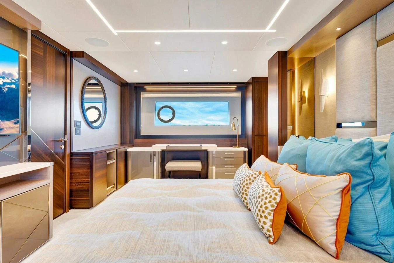 a bed with pillows and a television in a room aboard 76 YACHT Yacht for Sale