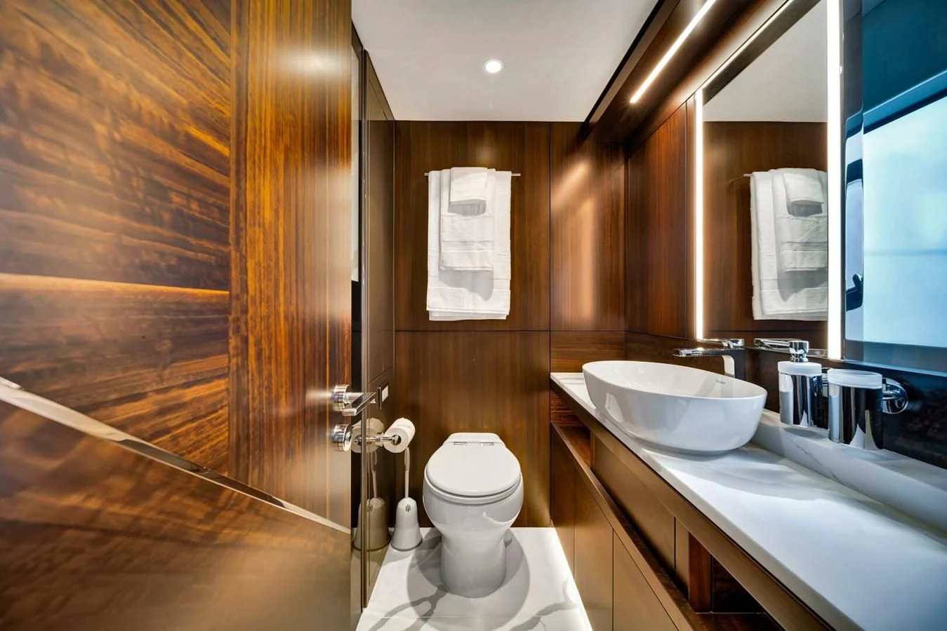 a bathroom with a sink toilet and a mirror aboard 76 YACHT Yacht for Sale