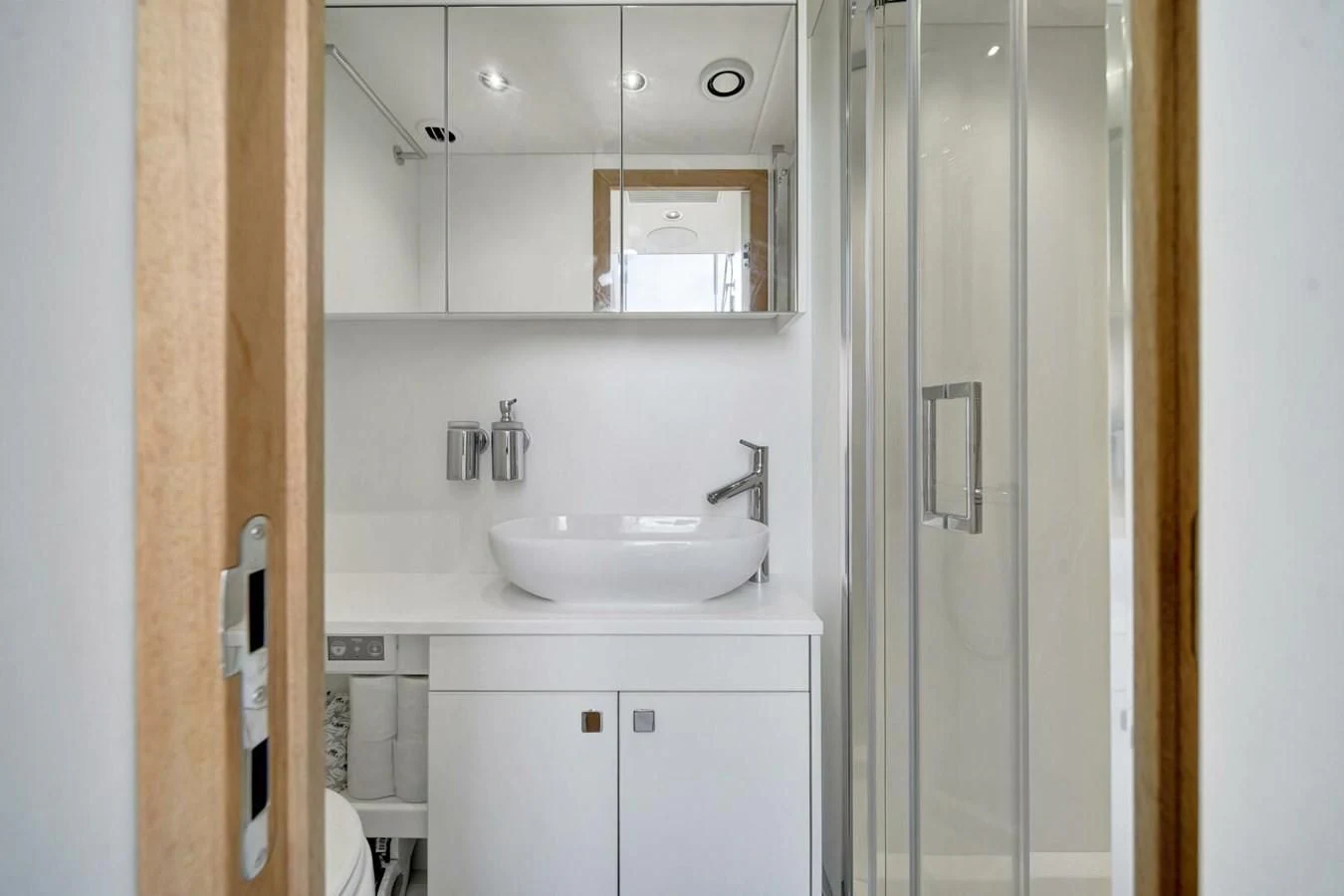 a bathroom with a sink and a mirror aboard 76 YACHT Yacht for Sale