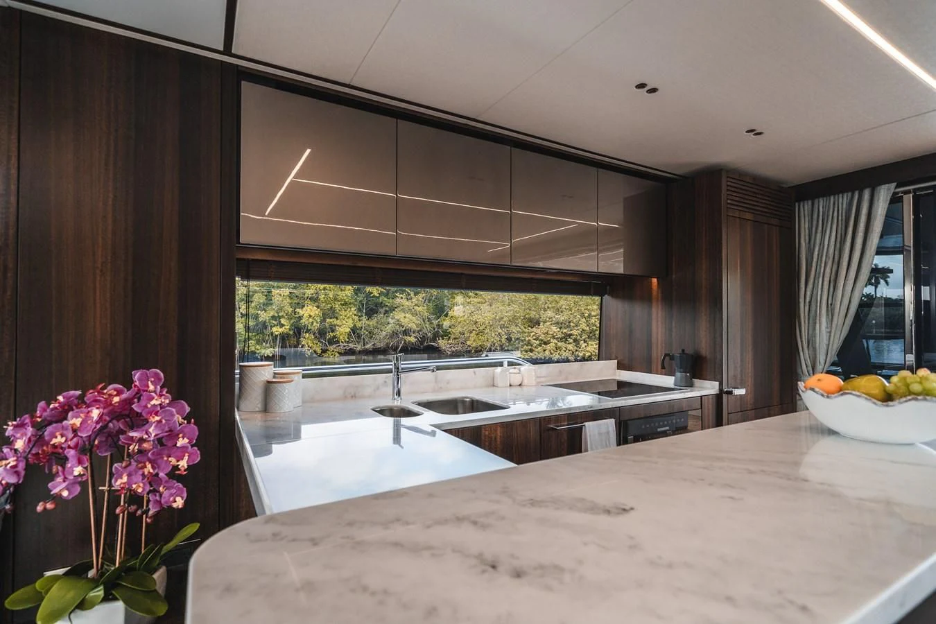 a kitchen with a large island aboard 76 YACHT Yacht for Sale