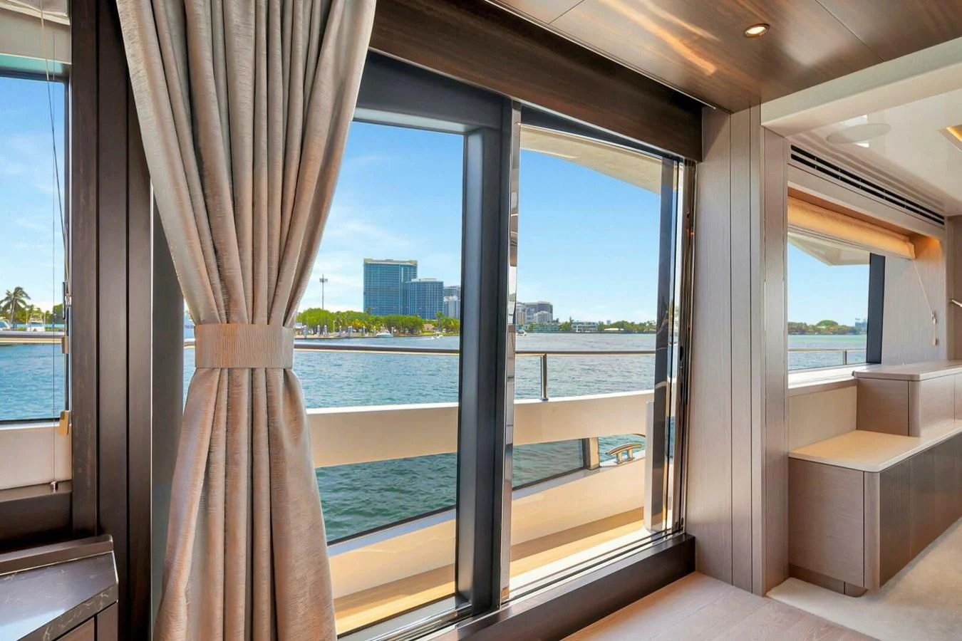 a room with a large window and a view of the water aboard 76 YACHT Yacht for Sale