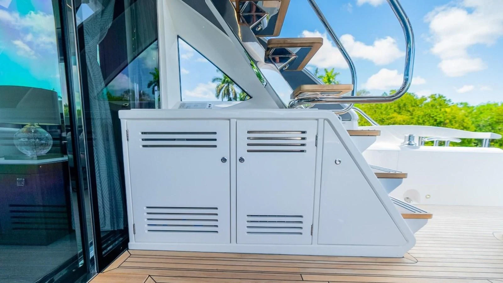 a white car with doors open aboard 76 YACHT Yacht for Sale