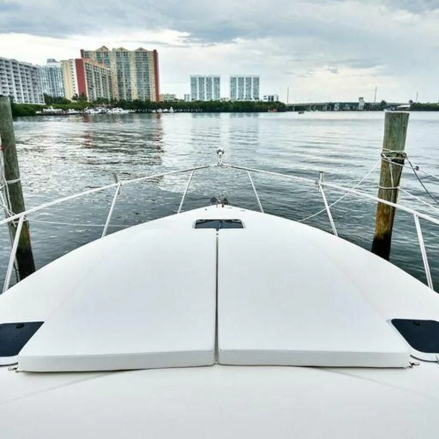 a white boat on a river aboard 76 YACHT Yacht for Sale