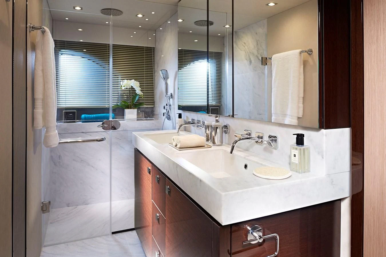 a bathroom with a sink and a mirror aboard 76 YACHT Yacht for Sale