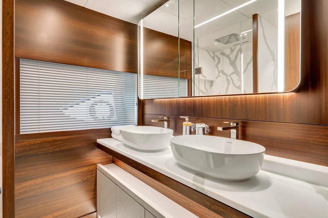 a bathroom with two sinks aboard 76 YACHT Yacht for Sale