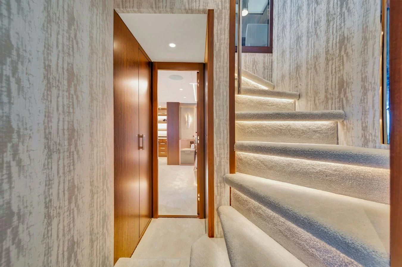 a hallway with a door and a staircase aboard 76 YACHT Yacht for Sale
