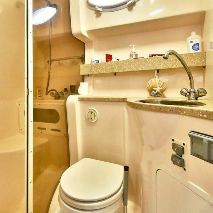 a bathroom with a toilet and sink aboard 76 YACHT Yacht for Sale