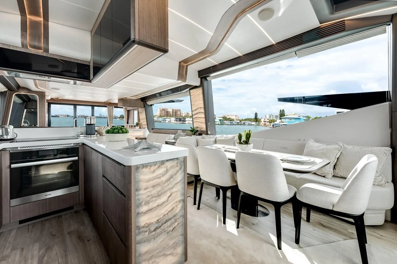 a kitchen with a dining table aboard 76 YACHT Yacht for Sale
