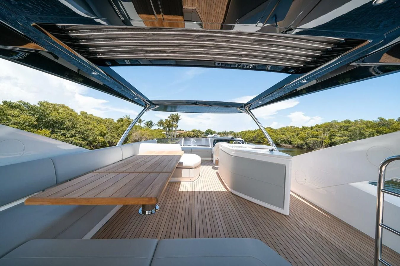 a deck with a bench and a table on it aboard 76 YACHT Yacht for Sale