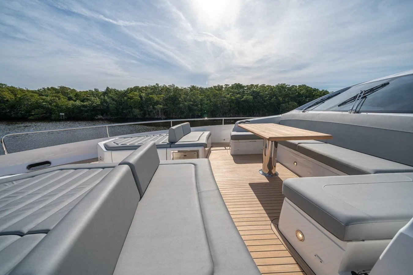 a deck with a table and chairs on it aboard 76 YACHT Yacht for Sale