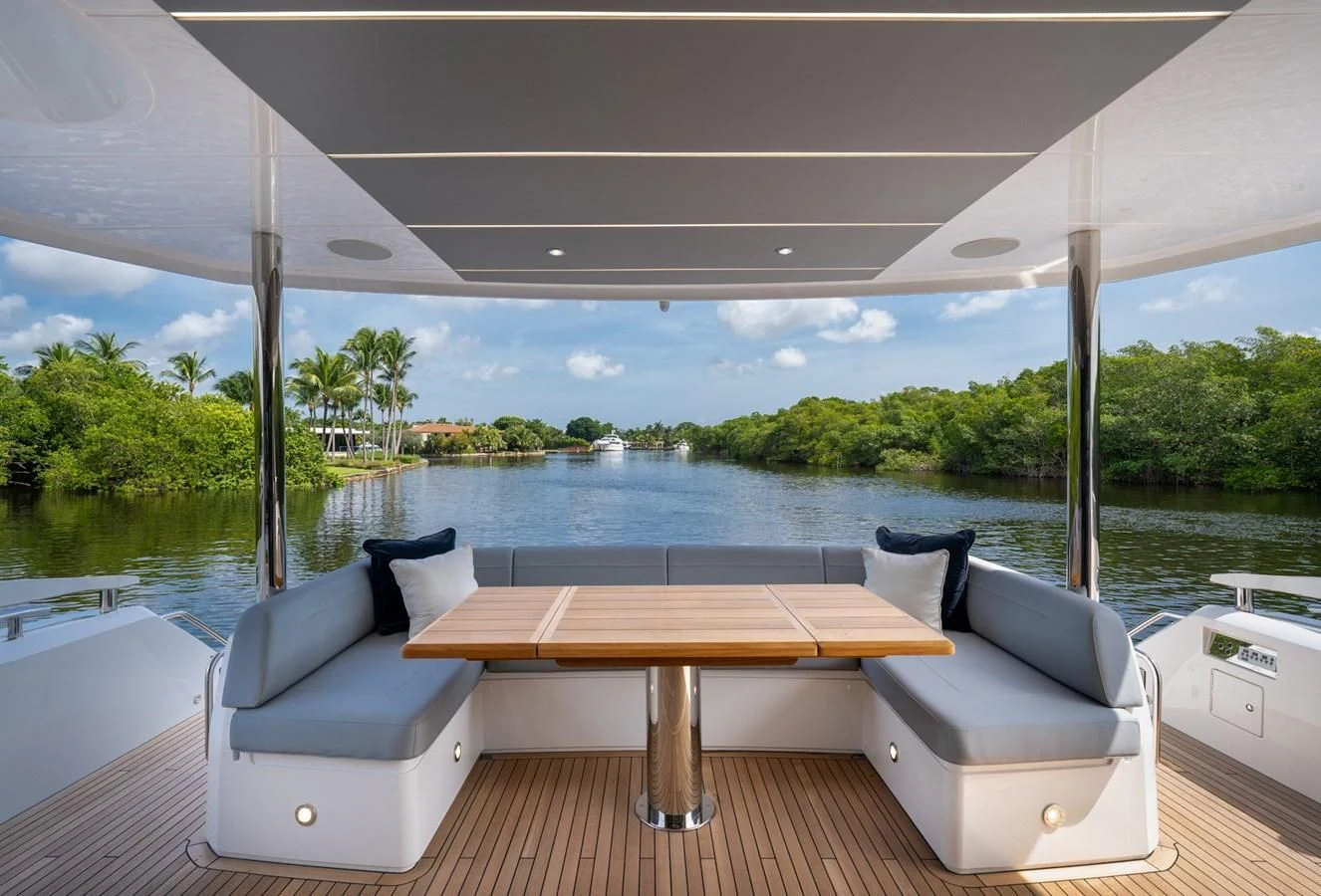 a table and a couch on a boat aboard 76 YACHT Yacht for Sale