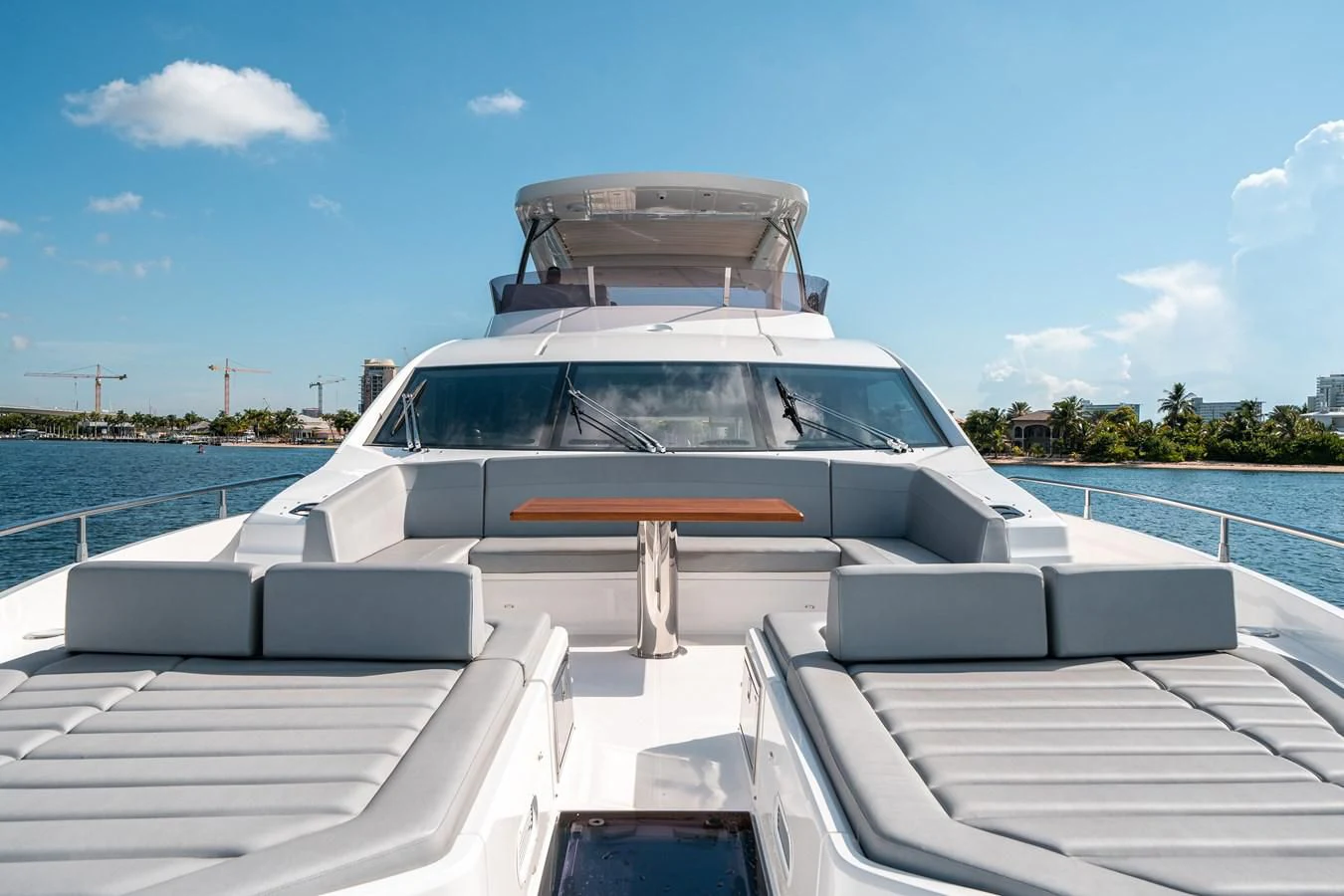 a white car with a large open top on a boat aboard 76 YACHT Yacht for Sale