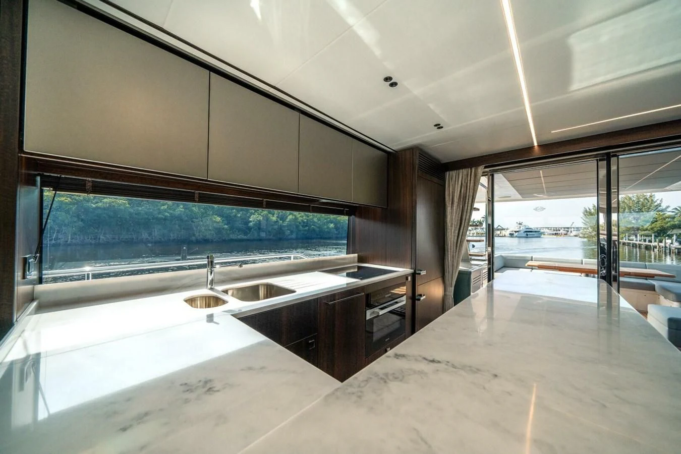 a large kitchen with a large window aboard 76 YACHT Yacht for Sale