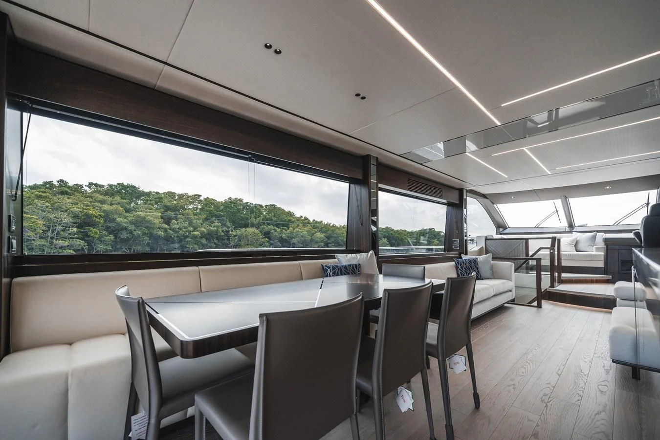 inside of a vehicle with a large window and a view of the trees aboard 76 YACHT Yacht for Sale
