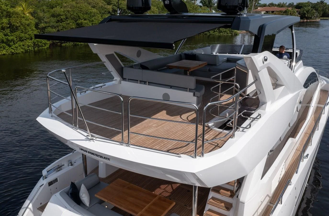 a boat with a person sitting on it aboard 76 YACHT Yacht for Sale